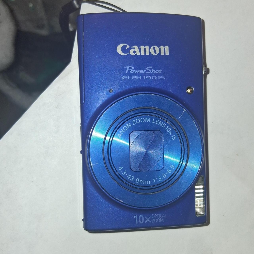 Canon Blue Digital Camera with Compact Design and Retractable Lens